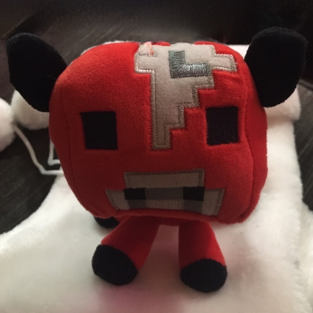 Red Plush Toy with Black Accents